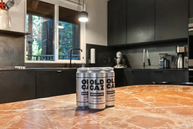 a bathroom with a sink a mirror and a shower