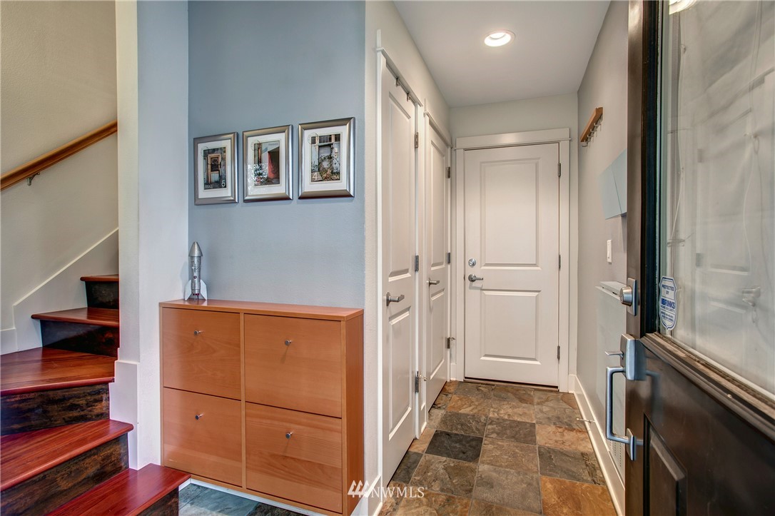 921 North 35th Street, Unit C Seattle, WA 98103 - Photo 2 of 17 a view of a hallway to an empty room and wooden floor