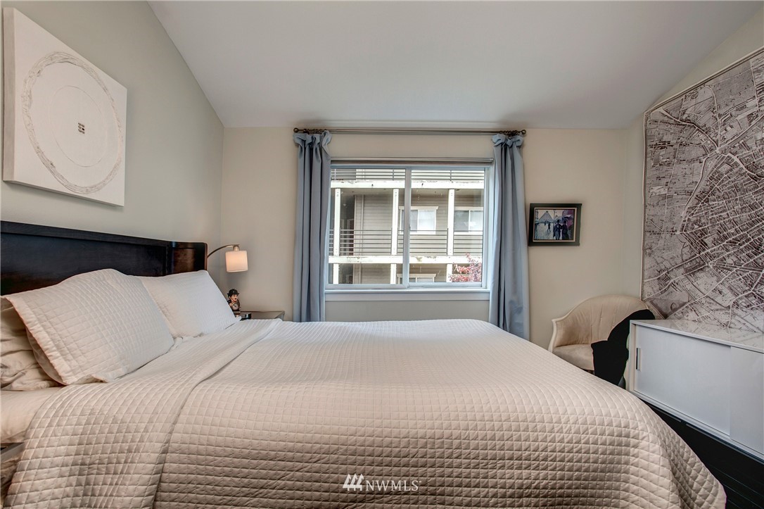 921 North 35th Street, Unit C Seattle, WA 98103 - Photo 11 of 17 a bedroom with a bed and a window