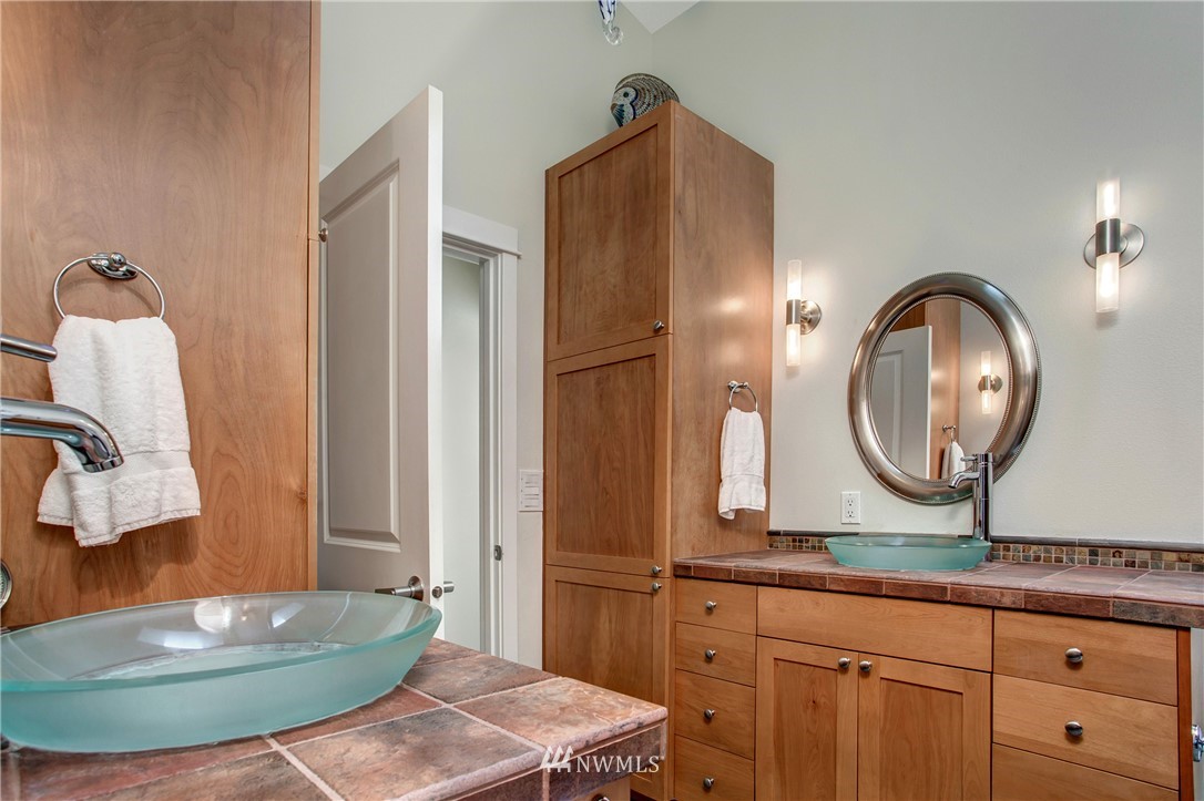 921 North 35th Street, Unit C Seattle, WA 98103 - Photo 14 of 17 a bathroom with a sink and a mirror