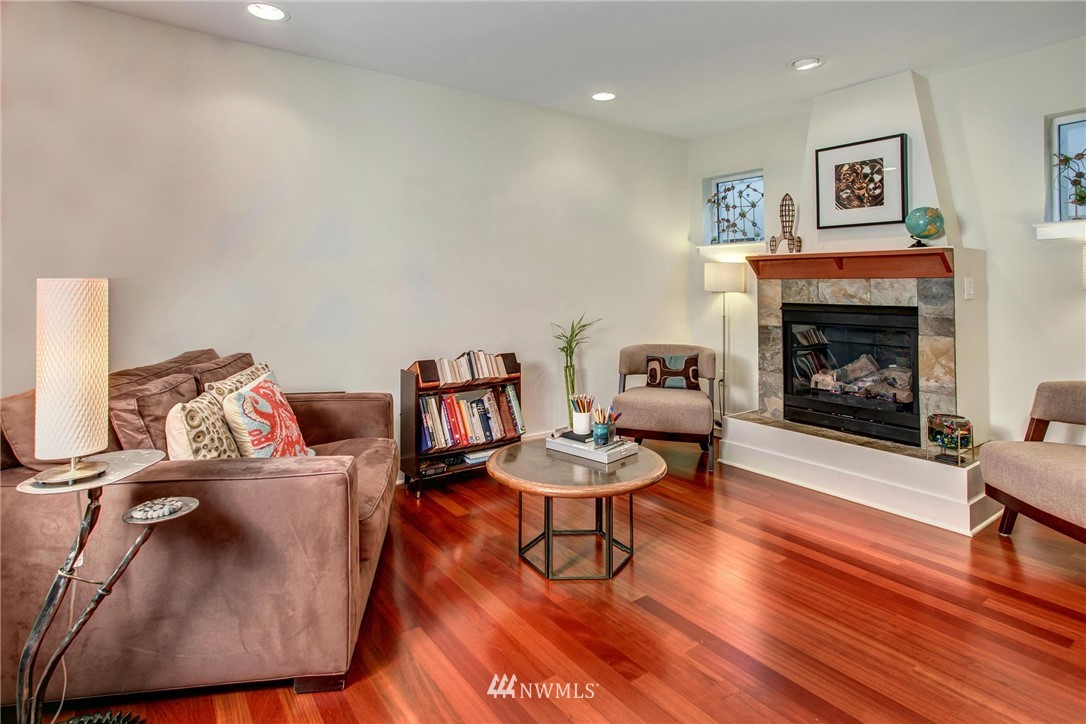 921 North 35th Street, Unit C Seattle, WA 98103 - Photo 8 of 17 a living room with furniture and a fireplace