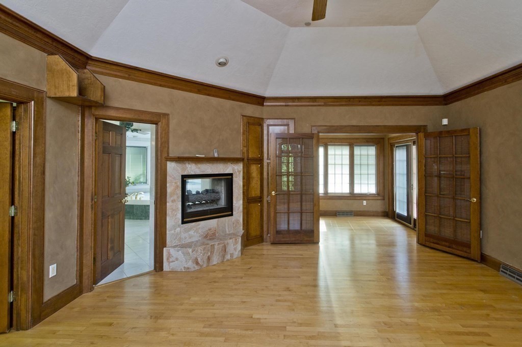 155 Edwards Road Westhampton, MA 01027 - Photo 26 of 39 a view of a hallway with wooden floor and a fireplace