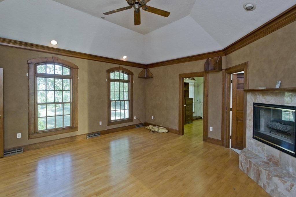 155 Edwards Road Westhampton, MA 01027 - Photo 27 of 39 a view of an empty room with a fireplace and a window