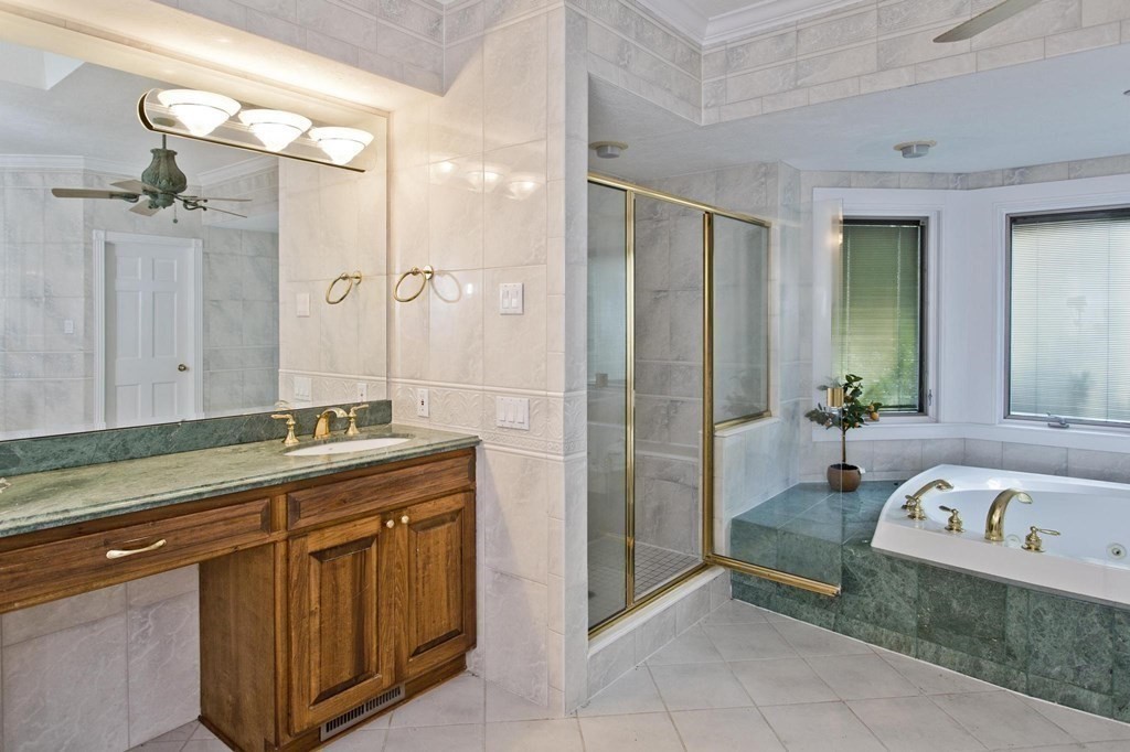 155 Edwards Road Westhampton, MA 01027 - Photo 31 of 39 a spacious bathroom with a granite countertop sink and a mirror
