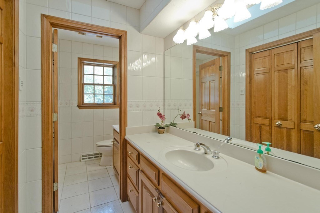 155 Edwards Road Westhampton, MA 01027 - Photo 35 of 39 a bathroom with 2 sink tub and a mirror