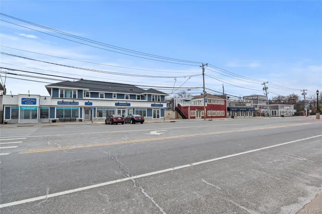 a view of cars parked in front of a building