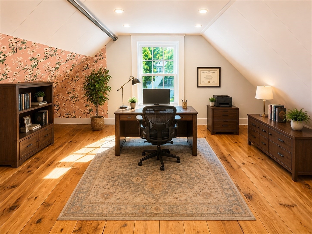 36 Plummer Avenue Lowell, MA 01852 - Photo 23 of 23 a living room with furniture and a fireplace