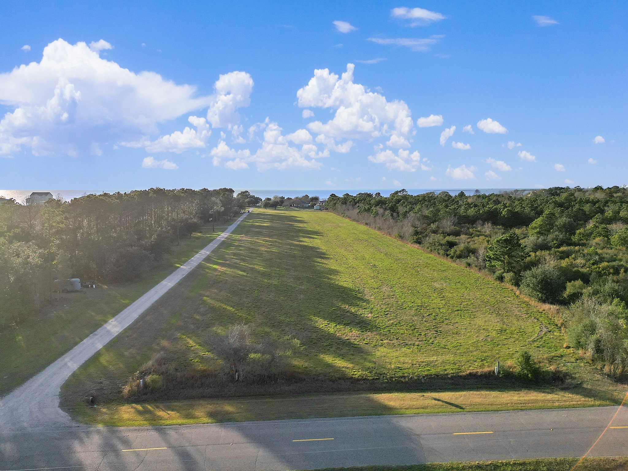 0 West Bayshore Road Anahuac, TX 77514 - Photo 6 of 8 a view of a lake in middle of the town
