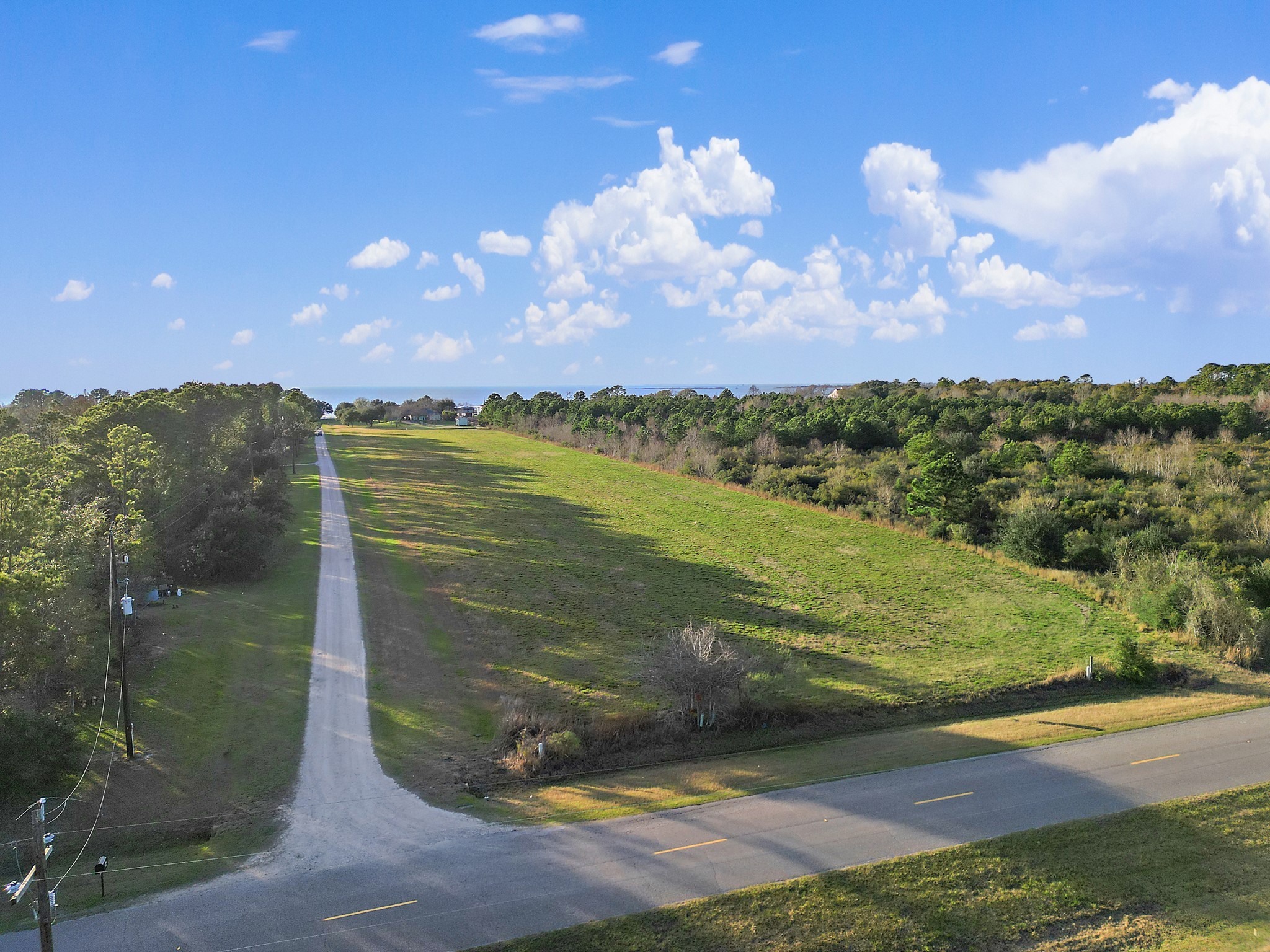 0 West Bayshore Road Anahuac, TX 77514 - Photo 7 of 8 a view of a lake in front of a house