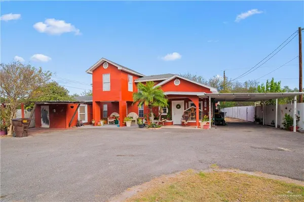 a view of a house with basketball court