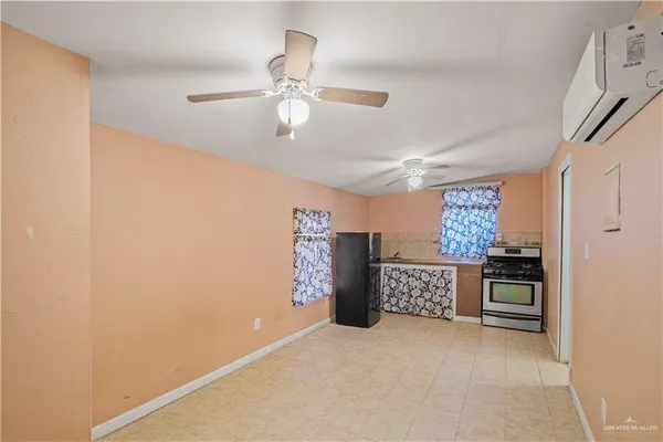 a kitchen with stainless steel appliances granite countertop a stove and a refrigerator