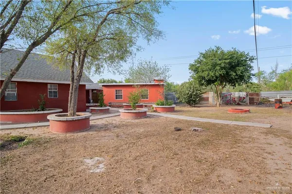 an aerial view of a house with outdoor space
