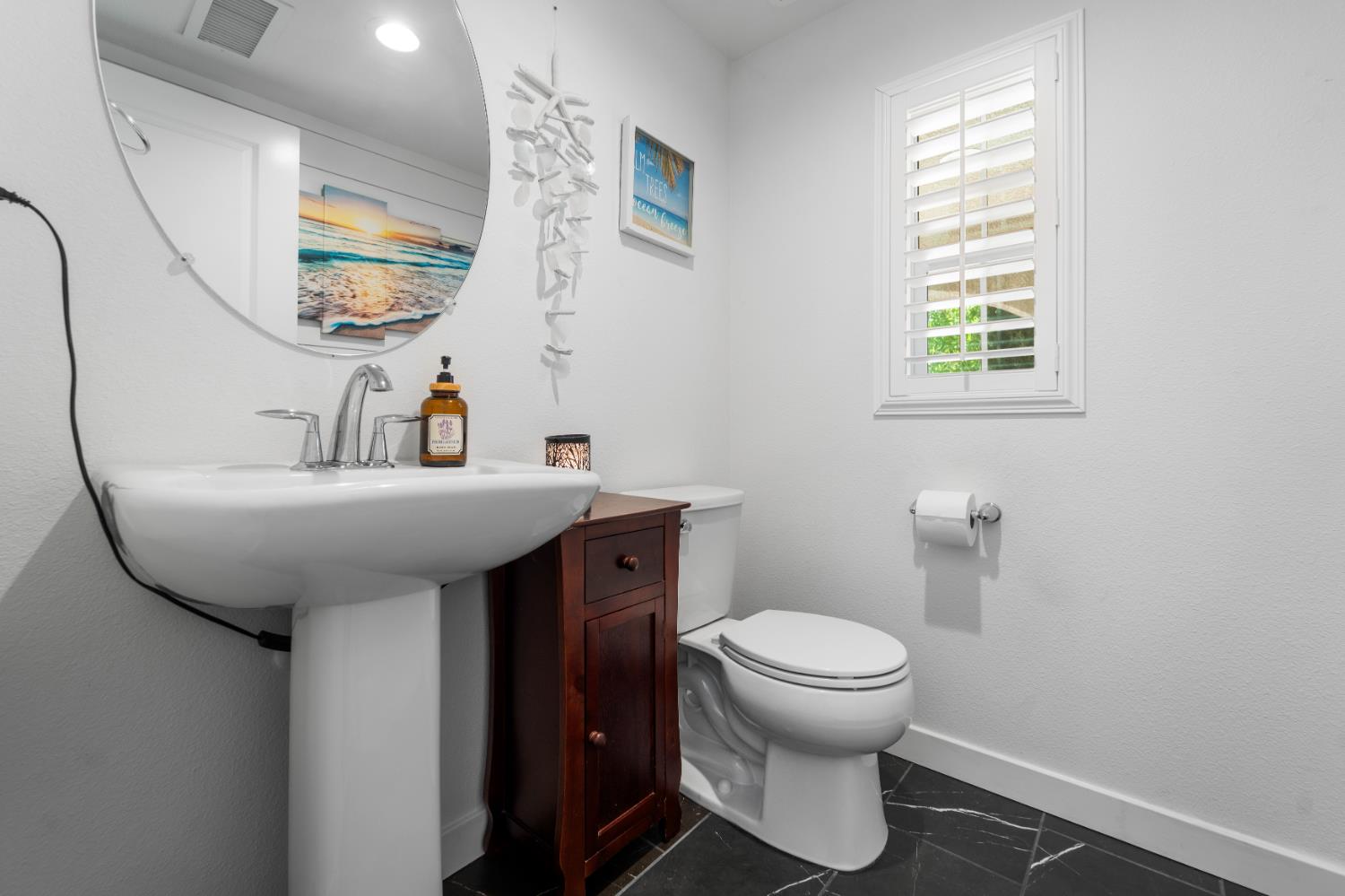 4301 San Miguel Road Madera, CA 93636 - Photo 9 of 60 a bathroom with a sink toilet and a mirror