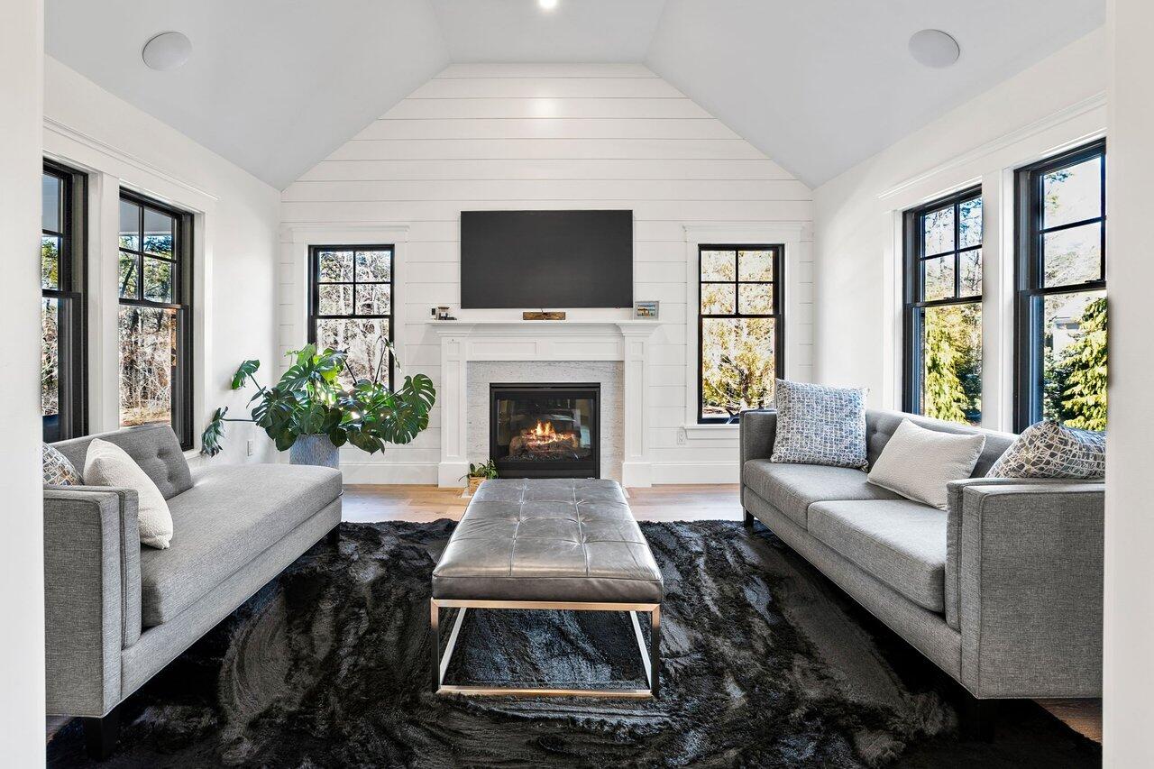 131 Old Barnstable Road Mashpee, MA 02649 - Photo 13 of 93 a living room with furniture a flat screen tv and a fireplace