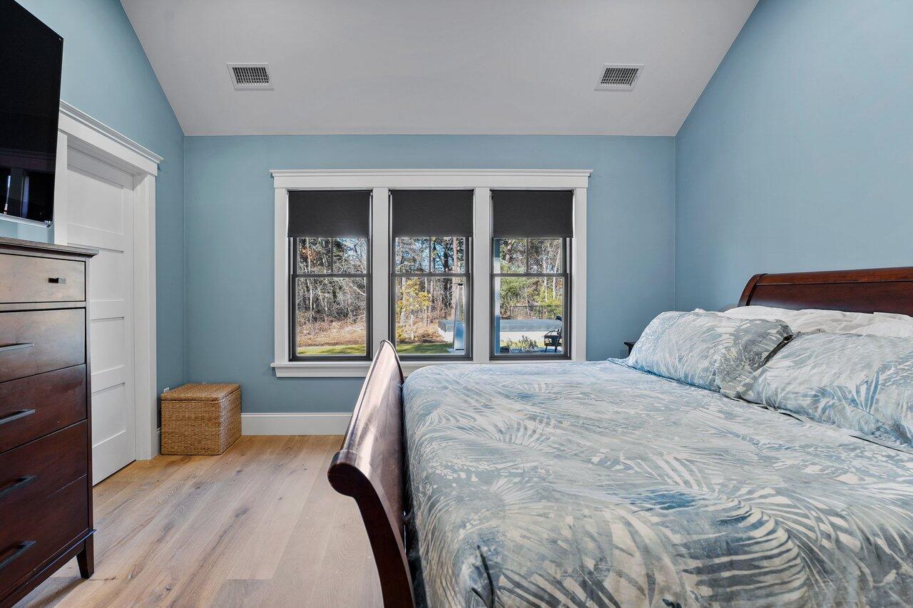 131 Old Barnstable Road Mashpee, MA 02649 - Photo 22 of 93 a bedroom with a large bed and a window