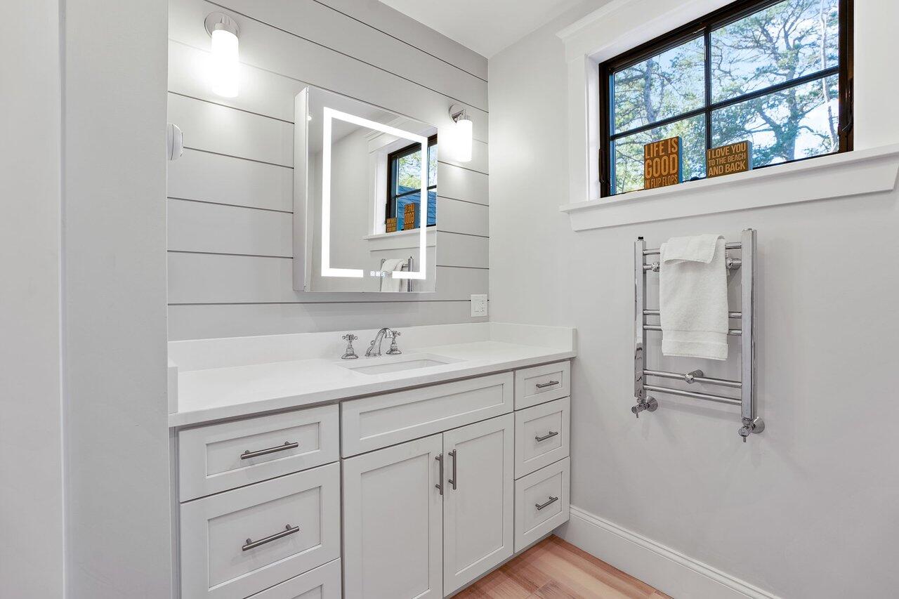 131 Old Barnstable Road Mashpee, MA 02649 - Photo 25 of 93 a bathroom with a sink and a mirror