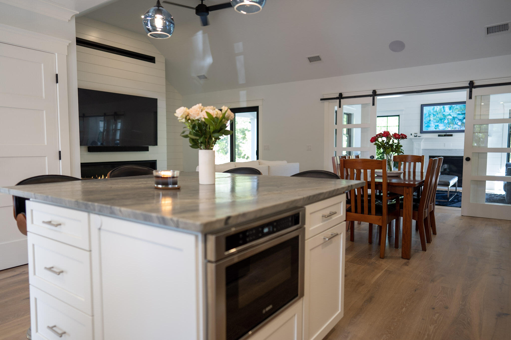 131 Old Barnstable Road Mashpee, MA 02649 - Photo 31 of 93 a kitchen with stainless steel appliances granite countertop a dining table chairs and granite counter tops