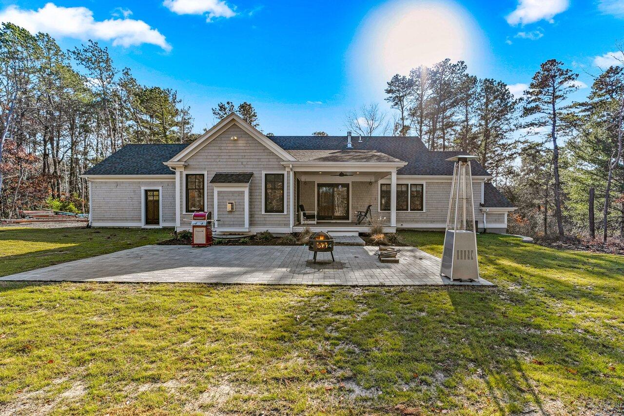 131 Old Barnstable Road Mashpee, MA 02649 - Photo 49 of 93 a front view of a house with swimming pool and porch