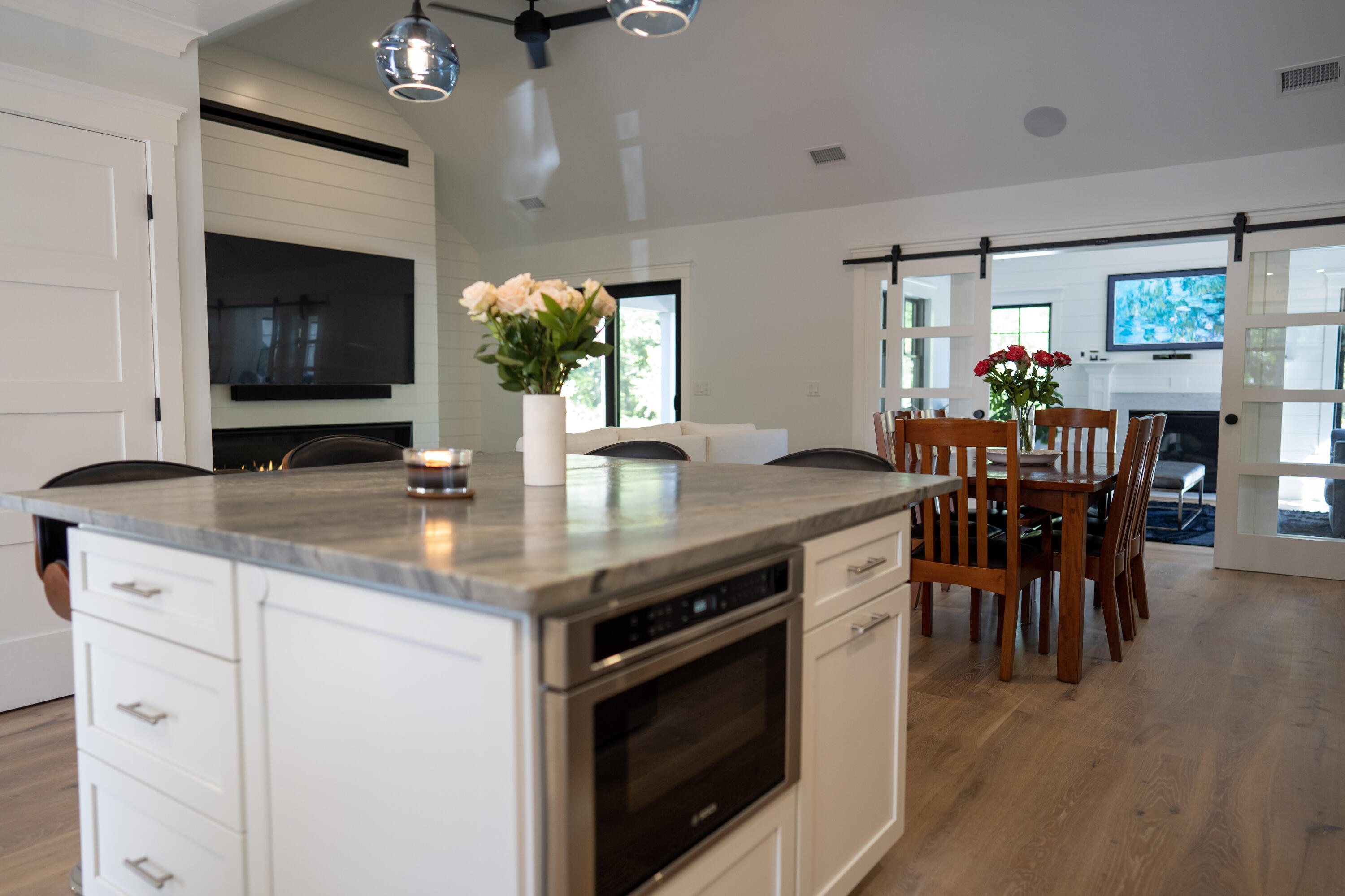 131 Old Barnstable Road Mashpee, MA 02649 - Photo 6 of 93 a kitchen with stainless steel appliances granite countertop a dining table chairs and granite counter tops