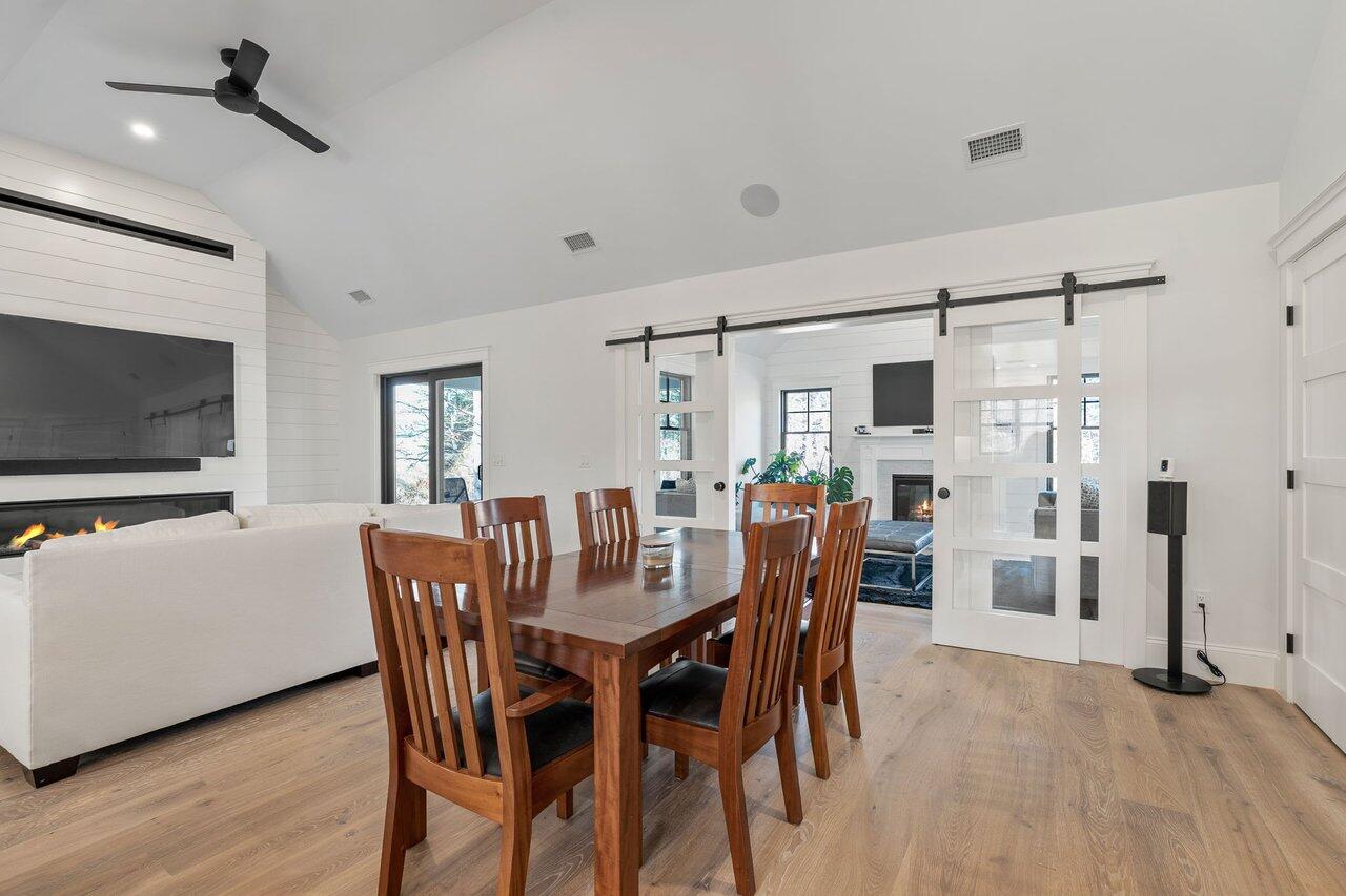 131 Old Barnstable Road Mashpee, MA 02649 - Photo 7 of 93 a view of a dining room with furniture and wooden floor