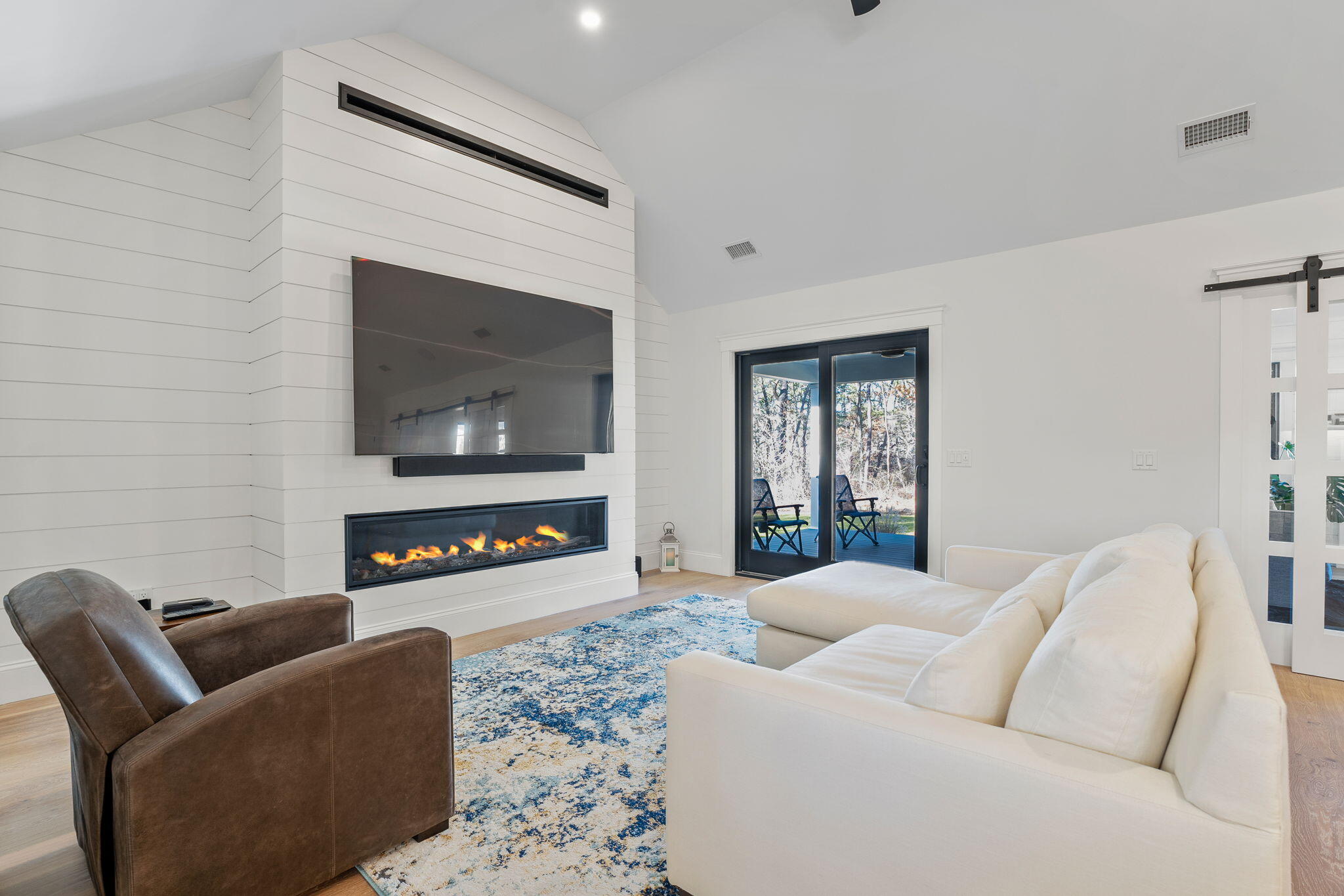 131 Old Barnstable Road Mashpee, MA 02649 - Photo 88 of 93 a living room with furniture and a flat screen tv