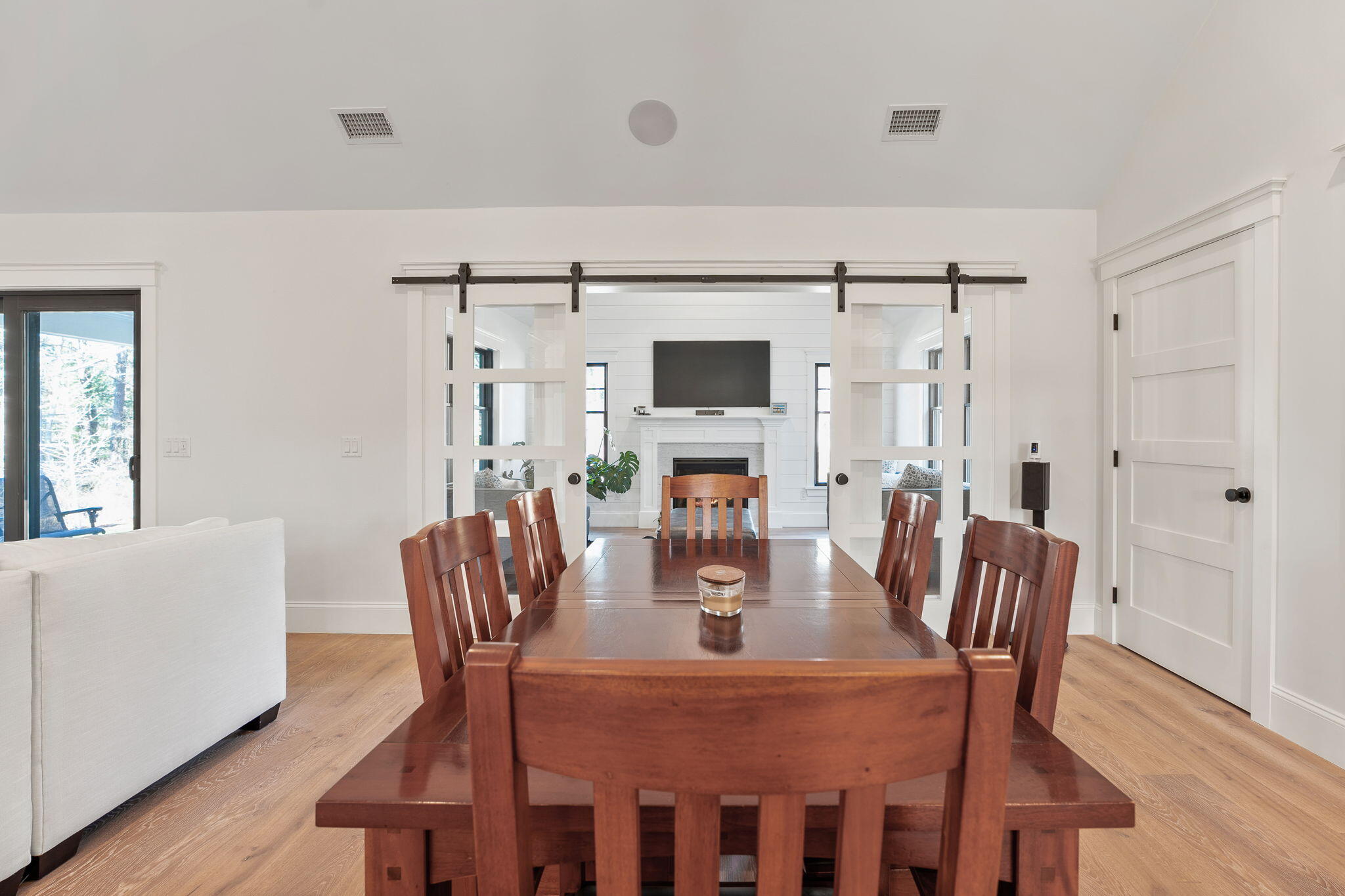 131 Old Barnstable Road Mashpee, MA 02649 - Photo 92 of 93 a dining room with furniture a chandelier and wooden floor