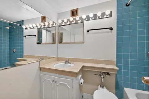 a bathroom with a sink and mirror