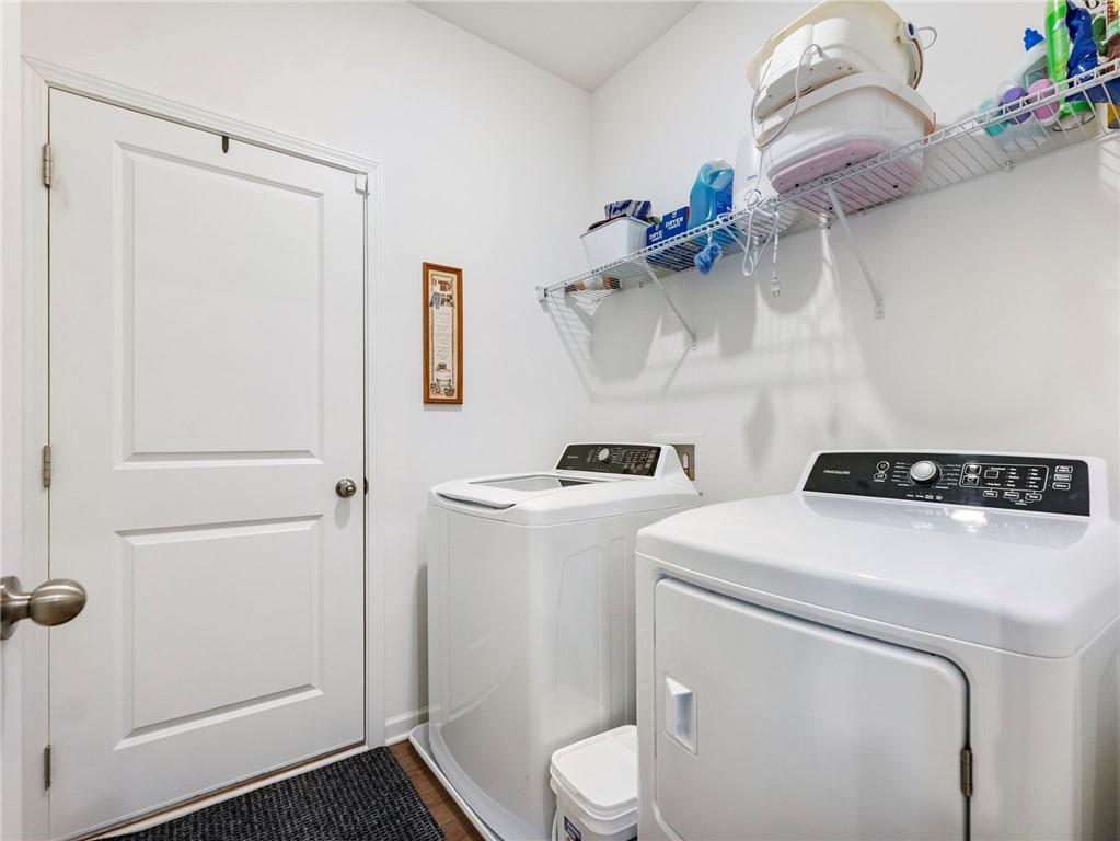 680 Groover Street Ball Ground, GA 30107 - Photo 15 of 42 a utility room with dryer and washer