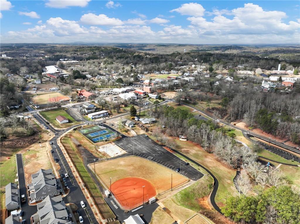 680 Groover Street Ball Ground, GA 30107 - Photo 34 of 42 an aerial view of residential houses with outdoor space