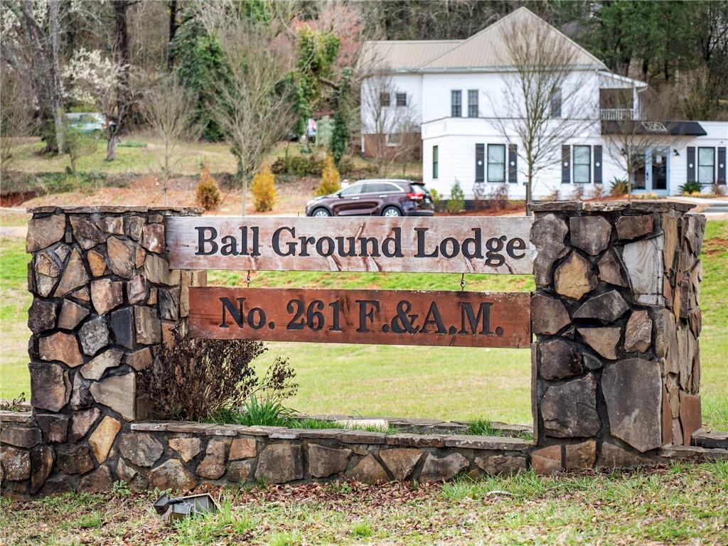680 Groover Street Ball Ground, GA 30107 - Photo 35 of 42 a sign on the side of a building