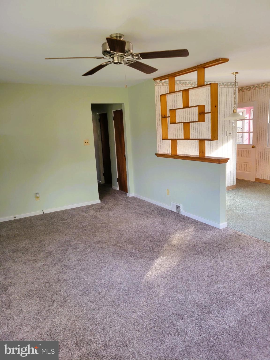 24 Nestler Road Bridgeton, NJ 08302 - Photo 11 of 41 a view of an empty room with wooden floor and a window