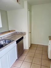 7839 Fuqua Street, Unit 7839 Houston, TX 77075 - Photo 4 of 10 a kitchen with a sink cabinets and utility room