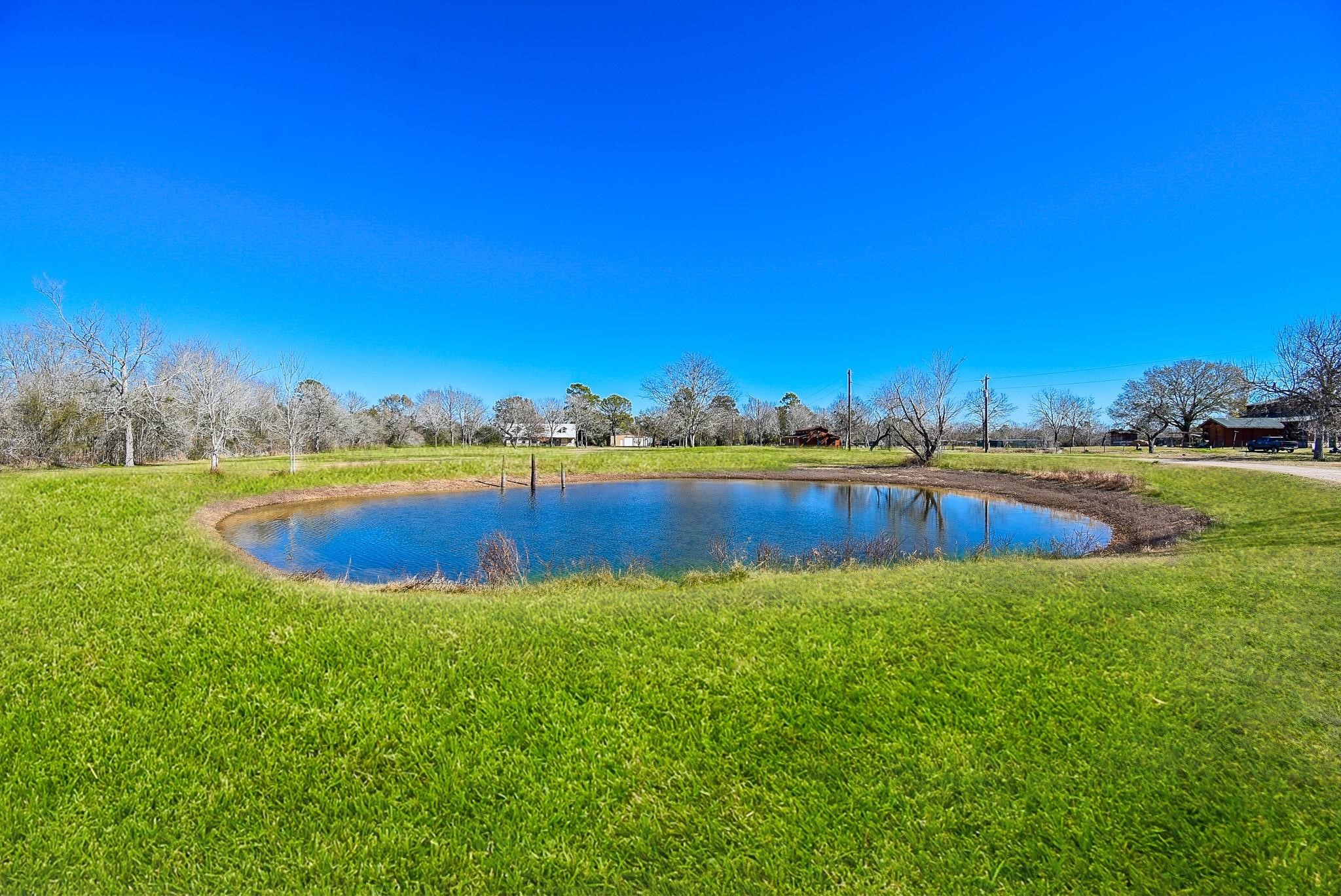 13380 Fm 359 Road Hempstead, TX 77445 - Photo 4 of 4 a view of a lake with houses in the back