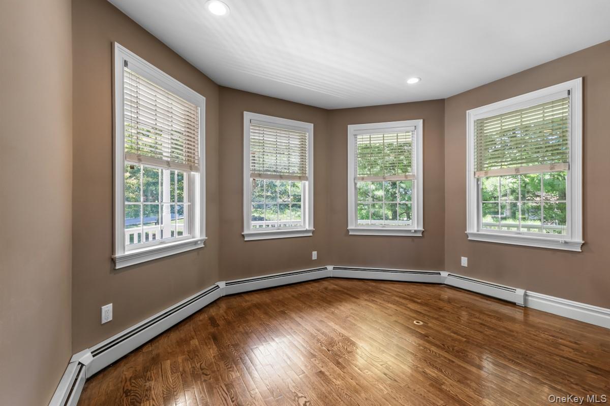 9 Ronwood Road Chestnut Ridge, NY 10977 - Photo 18 of 48 a view of empty room with wooden floor and fan
