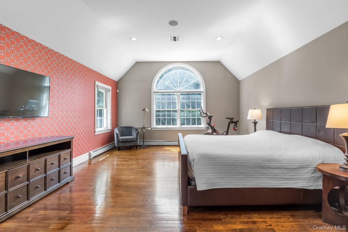 9 Ronwood Road Chestnut Ridge, NY 10977 - Photo 23 of 48 a bedroom with a bed and a flat screen tv