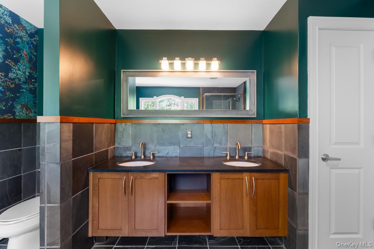 9 Ronwood Road Chestnut Ridge, NY 10977 - Photo 26 of 48 a room with a sink and a mirror