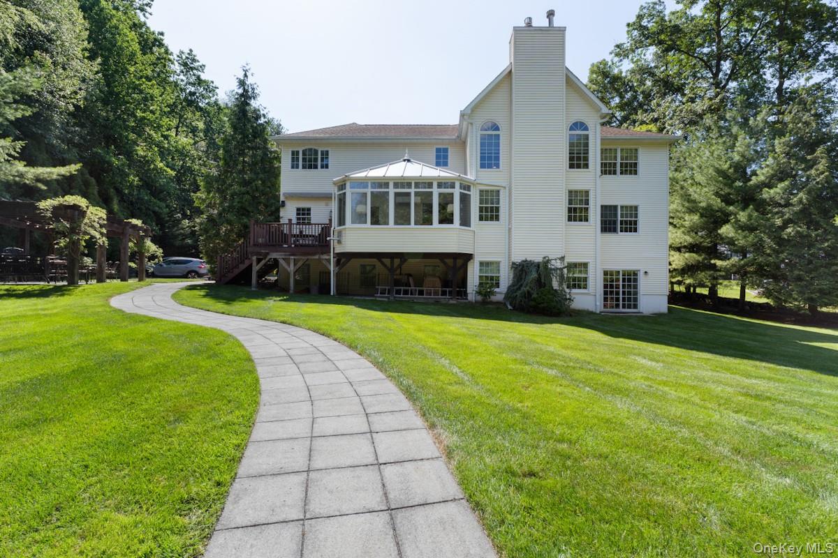 9 Ronwood Road Chestnut Ridge, NY 10977 - Photo 39 of 48 a front view of house with yard and green space