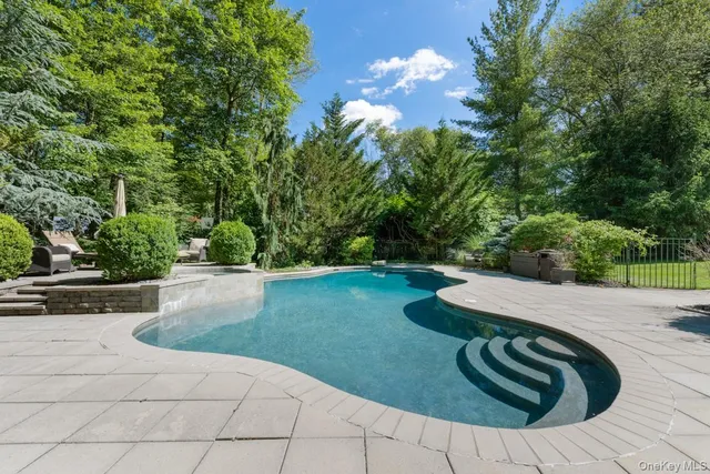 a view of backyard with trampoline