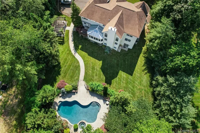 an aerial view of a house with outdoor space and street view