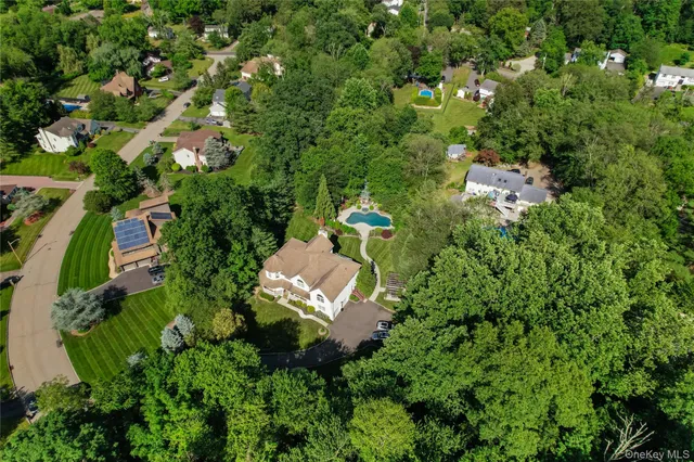 a view of a green field with lots of bushes
