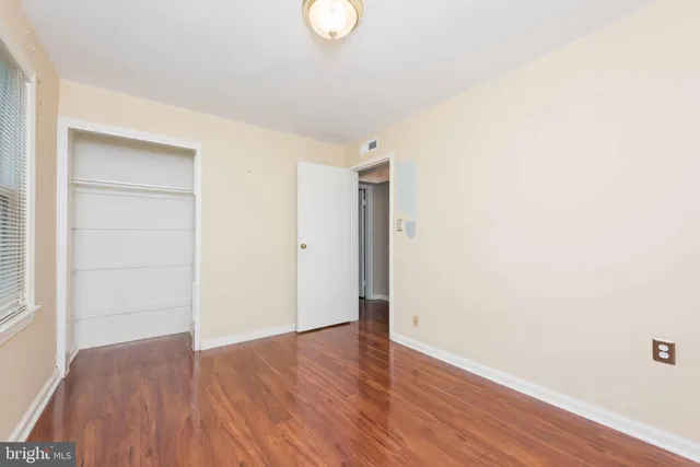 a view of a room with wooden floor