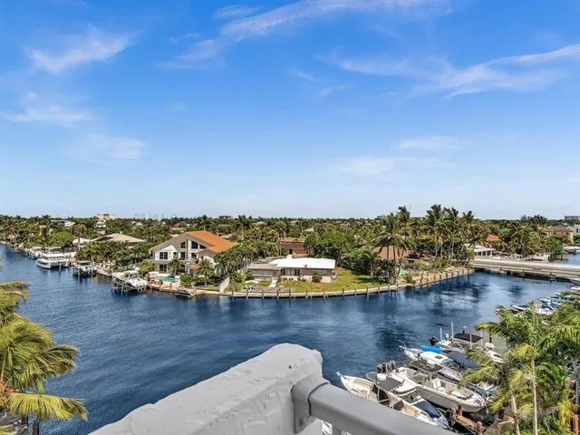an aerial view of a house with a lake view