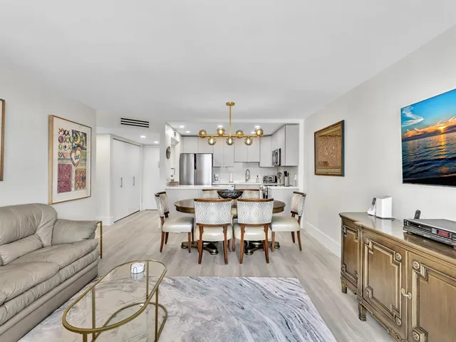 a balcony with a table and chairs