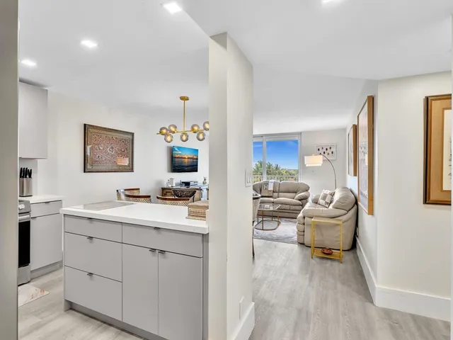 a view of kitchen with furniture and wooden floor