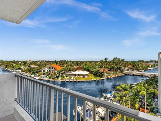 a view of a balcony with chairs