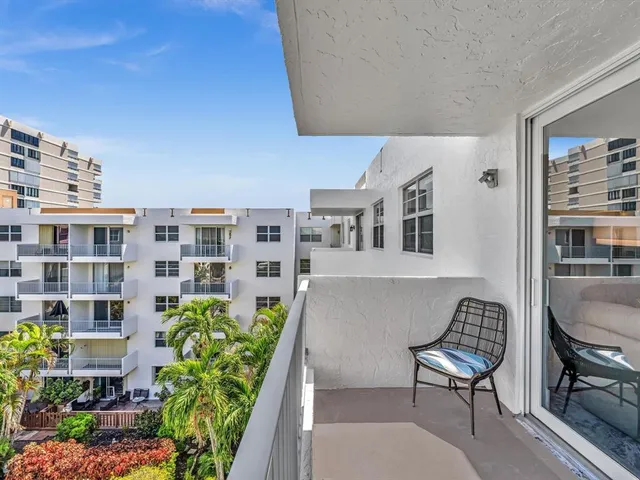 a bedroom with a bed a desk and chair