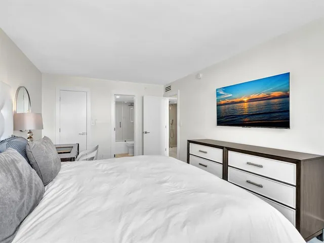 a kitchen with a refrigerator and cabinets