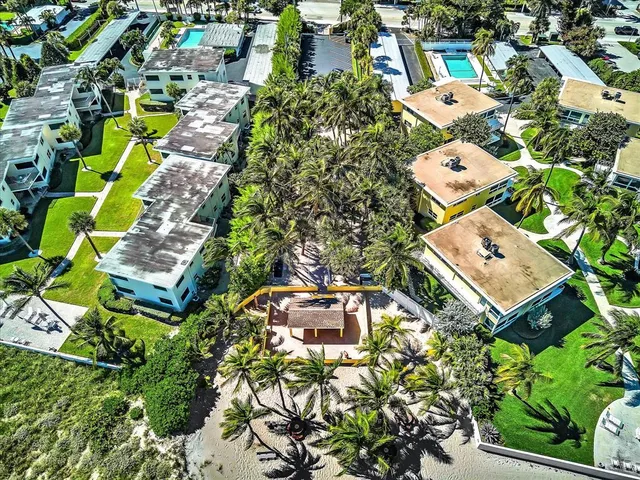 a view of a chairs and table in patio