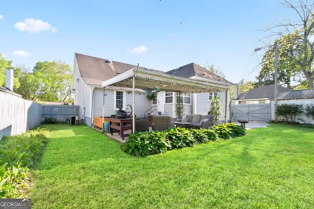 a front view of a house with a garden and plants