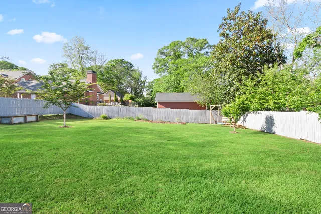 a backyard of a house with lots of green space